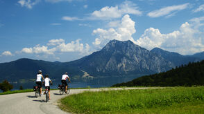 Family cycling trip around a beautiful mountain lake