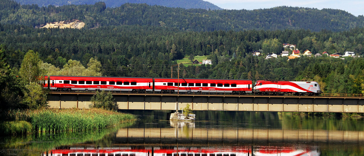 The "Austrian Train" travels through scenic landscape